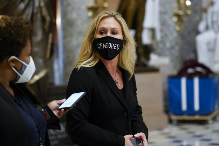 Rep. Marjorie Taylor Greene, R-Ga., walks on Capitol Hill in Washington, Wednesday, Jan. 13, 2021.
