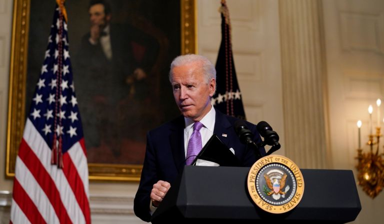 President Joe Biden leaves after delivering remarks on COVID-19, in the State Dining Room of the White House, Tuesday, Jan. 26, 2021, in Washington.
