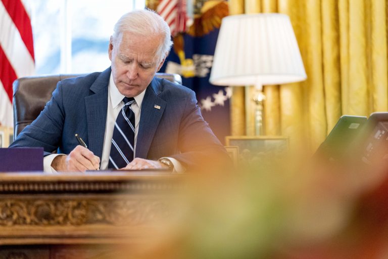 Biden signs major defense spending bill into law