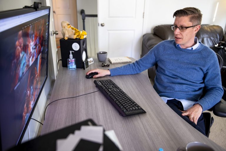 Mike Winkelmann, who goes by Beeple, shows off his digital art process in his home studio, Wednesday, Feb. 24, 2021, in Ladson, S.C. The $69.3 million March 11 online auction of a collage of 5,000 images by the artist by Christieâs auction house in London catapulted Beepleâs artwork into a league of the most expensive ever sold by a living artist. (Andrew J. Whitaker/The Post And Courier via AP)