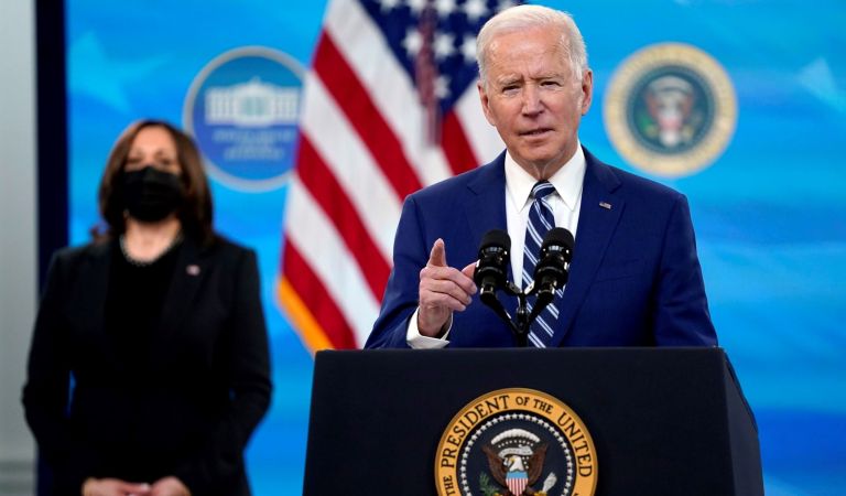 President Joe Biden speaks during an event on COVID-19 vaccinations, in the South Court Auditorium on the White House campus, Monday, March 29, 2021, in Washington, as Vice President Kamala Harris listens.