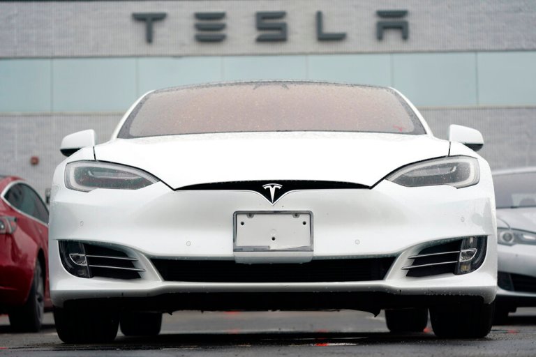 In this photograph from May 9, 2021, an unsold S 70 sedan sits at a Tesla dealership in Littleton, Colorado. 