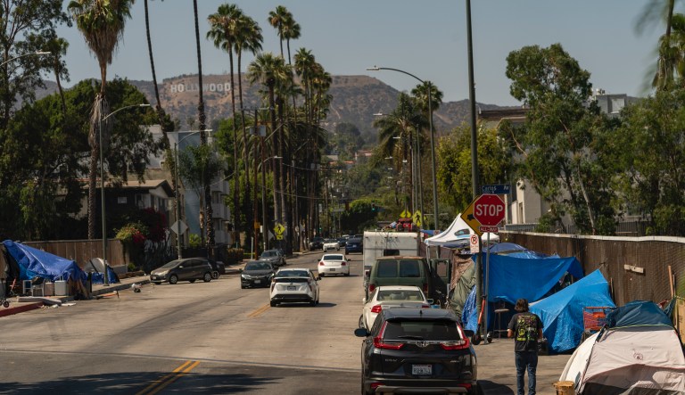 Homeless encampments are installed on an overpass of the CA-101 Hollywood freeway in Los Angeles, Wednesday, July 7, 2021.