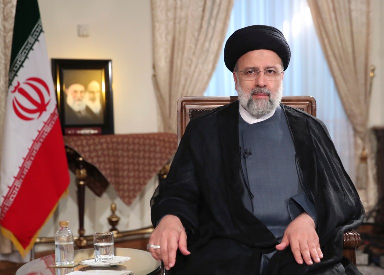 Iranian President Ebrahim Raisi attends a live televised interview.