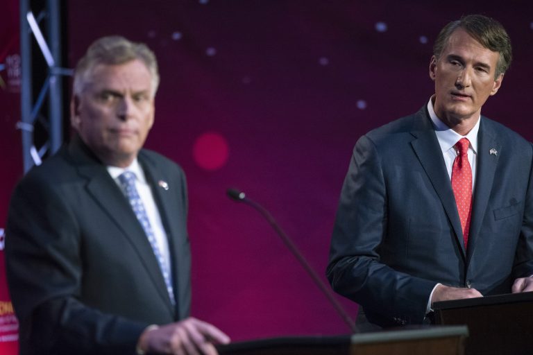 Gov. Terry McAuliffe, left, and Republican challenger, Glenn Youngkin, participate in a debate at Northern Virginia Community College, in Alexandria, Va., Tuesday, Sept. 28.