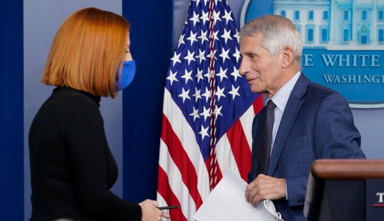 White House press secretary Jen Psaki walks to the podium as Dr. Anthony Fauci, director of the National Institute of Allergy and Infectious Diseases, departs after speaking about the COVID-19 variant named omicron during the daily briefing at the White House in Washington, Wednesday, Dec. 1, 2021. 