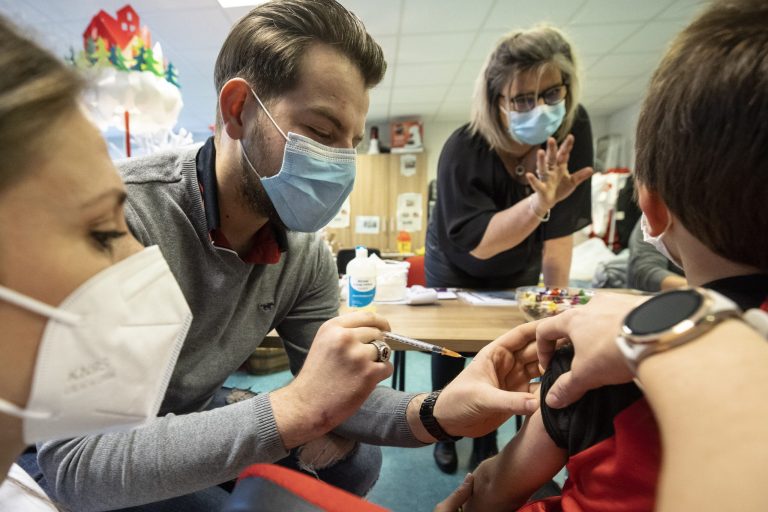 Children receive their vaccine shot in SÃ©lestat, eastern France, Tuesday, Dec. 21, 2021. Vaccines for children under 5 will become available in the D.C. area starting Monday. 
