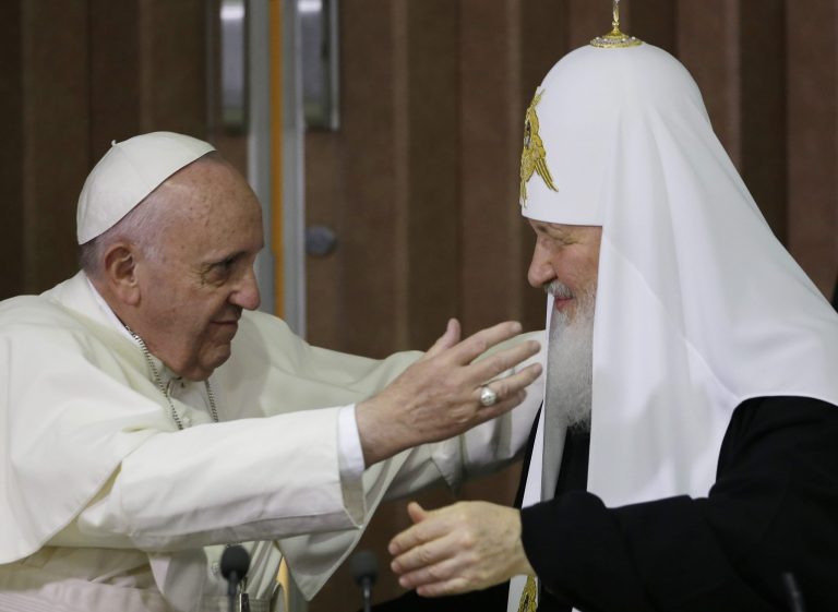 Pope Francis (left) reaches to embrace Russian Orthodox Patriarch Kirill after signing a joint declaration at the Jose Marti International Airport in Havana, Cuba, on Feb. 12, 2016.