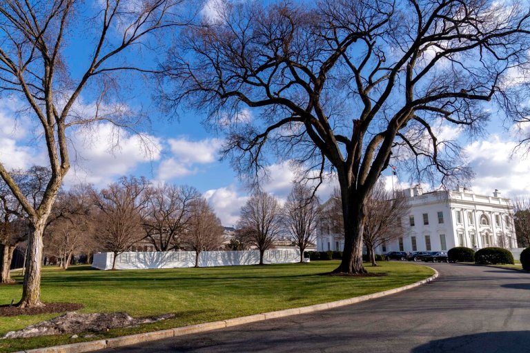 Temporary walls have been put up around the fountain on the North Lawn of the White House in Washington, Friday, Jan. 14, 2022.
