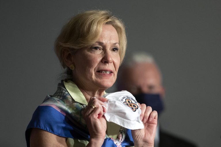 White House coronavirus response coordinator Dr. Deborah Birx holds her face mask as she speaks during a White House Coronavirus Task Force briefing in Washington on July 8, 2020.