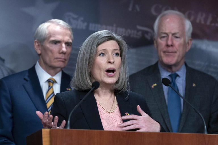 Sen. Joni Ernst, R-Iowa, flanked by Sen. Rob Portman, R-Ohio, and John Cornyn, R-Texas, speaks during a news conference about Ukraine on Capitol Hill in Washington, Wednesday, March 16, 2022. 