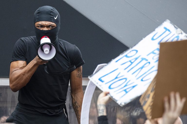 Activists rally for Patrick Lyoya in  Kalamazoo, Mich., on Tuesday, April 12, 2022.