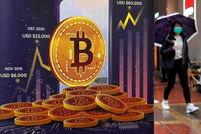 The Department of Justice filed charges in the first-ever digital asset insider trading scheme on June 1, 2022. (AP Photo/Kin Cheung, File)