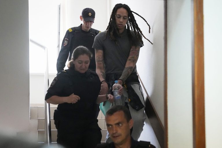 WNBA star and two-time Olympic gold medalist Brittney Griner is escorted to a courtroom for a hearing in Khimki, just outside Moscow, Russia, on June 27, 2022. Griner's trial is set to begin July 1.