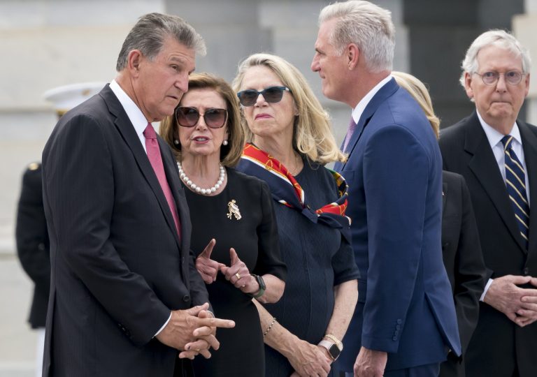 From left, Sen. Joe Manchin, D-W.Va., Speaker of the House Nancy Pelosi, D-Calif., Rep. Carol Miller, R-W.Va., House Minority Leader Kevin McCarthy, R-Calif., and Senate Minority Leader Mitch McConnell, R-Ky., stand together.