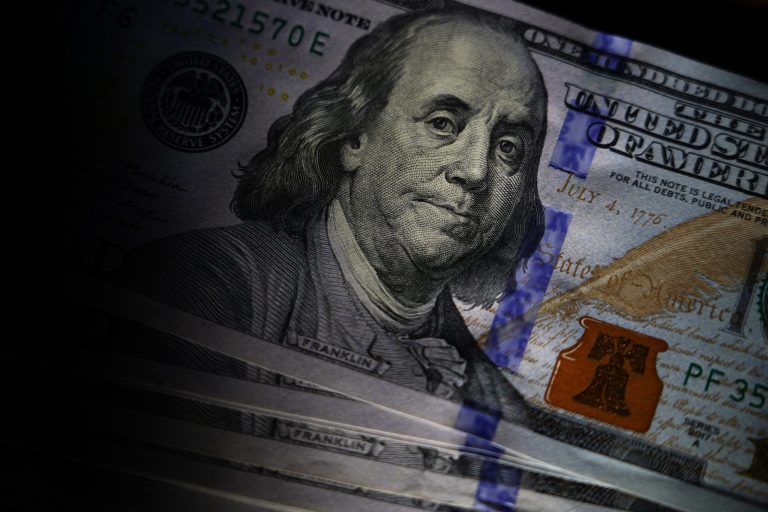 The likeness of Benjamin Franklin is seen on U.S. $100 bills, Thursday, July 14, 2022, in Marple Township, Pennsylvania. (AP Photo/Matt Slocum)