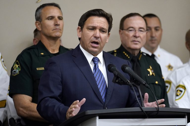 Florida Gov. Ron DeSantis gestures as he speaks during a news conference Thursday, Aug. 4, 2022, in Tampa, Florida. DeSantis announced that he was suspending State Attorney Andrew Warren, of the 13th Judicial Circuit, due to 