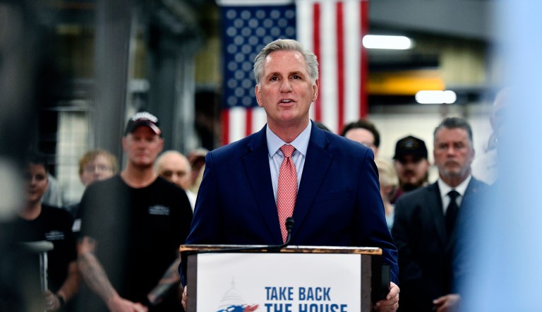 House Minority Leader Kevin McCarthy (R-CA) is backed by supporters as he speaks at Don's Machine Shop in West Pittston, Pennsylvania, on Sept. 1, 2022. 