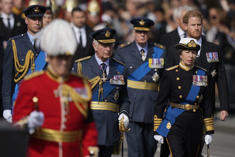 King Charles III, center left, Princess Anne, second right, Prince Harry, right, and Prince William, left, follow the coffin of Queen Elizabeth II during a procession from Buckingham Palace to Westminster Hall in London on Sept. 14, 2022.