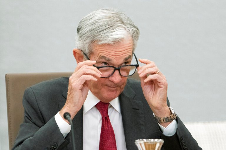 Federal Reserve Board Chairman Jerome Powell adjusts his glasses during a conversation with leaders from organizations that include nonprofits, small businesses, manufacturing, supply chain management, the hospitality industry, and the housing and education sectors at the Federal Reserve building, Friday, Sept. 23, 2022, in Washington.