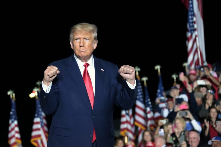 Former President Donald Trump gestures as he holds a rally Friday, Sept. 23, 2022, in Wilmington, North Carolina. A federal appeals court said on Tuesday it will seek guidance on whether Trump should be declared immune from author E. Jean Carroll's defamation lawsuit.