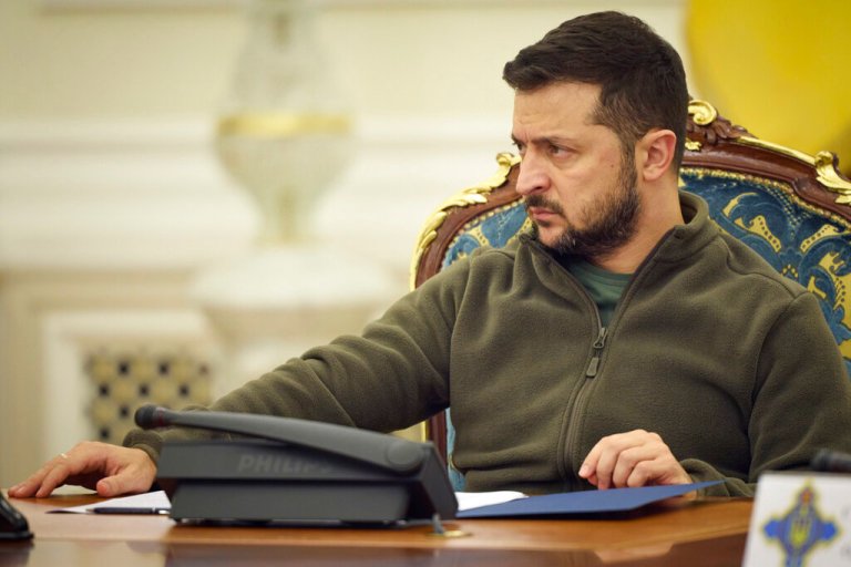 In this photo released by Ukrainian Presidential Press Office, Ukrainian President Volodymyr Zelenskyy leads a meeting of the National Security and Defense Council in Kyiv, Ukraine, Friday, Sept. 30, 2022. Ukraine's president says his country is submitting an 