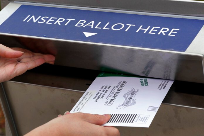 Justice Department receives report of voter intimidation at Arizona drop box