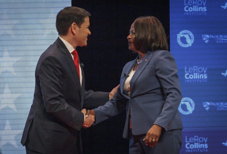 U.S. Sen. Marco Rubio, R-Fla., and his challenger, U.S. Rep. Val Demings, D-Fla., greet each other before a debate.