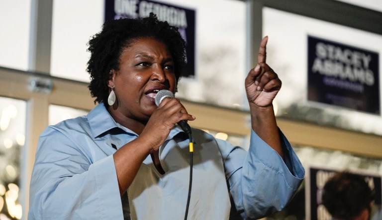 Democratic candidate for Georgia Governor Stacey Abrams speaks to volunteers during an election eve phone and text bank party Monday, Nov. 7, 2022 in Atlanta.