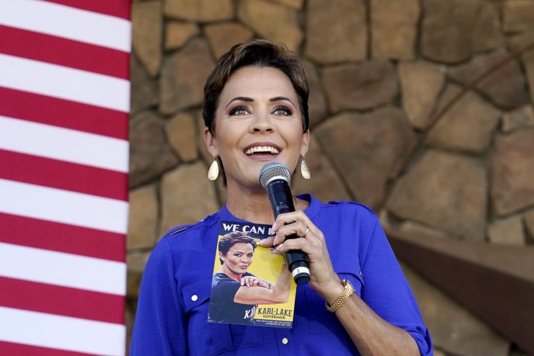 Republican gubernatorial candidate Kari Lake speaks to supporters at a campaign event in Queen Creek, Ariz., Oct. 5, 2022.