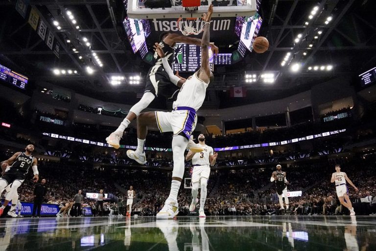 Milwaukee Bucks' Giannis Antetokounmpo blocks the shot of Los Angeles Lakers' LeBron James during the second half of an NBA basketball game Friday, Dec. 2, 2022, in Milwaukee.