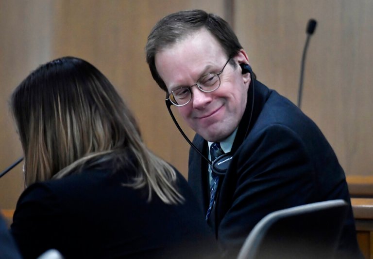 Mark Jensen, right, looks back to the gallery during the first day of his trial at the Kenosha County Courthouse.