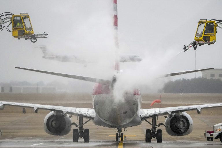 An American Airlines aircraft undergoes deicing procedures on Monday, Jan. 30, 2023, at Dallas/Fort Worth International Airport in Texas.
