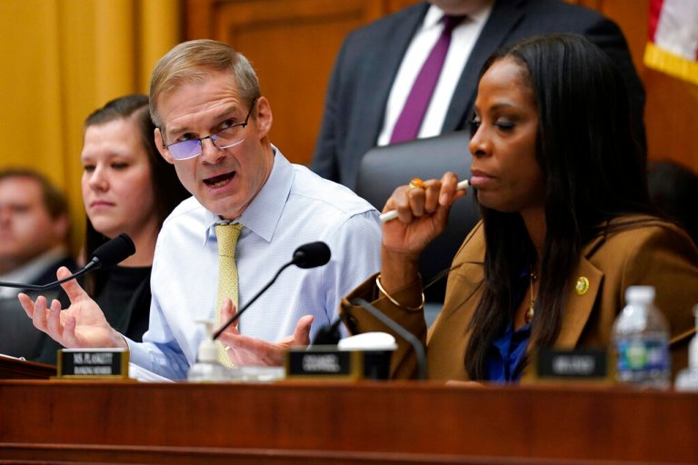 Chairman Jim Jordan, R-Ohio, left, speaks as Del. Stacey Plaskett, D-Virgin Islands, the ranking member, right, listens, during a House Judiciary subcommittee hearing on what Republicans say is the politicization of the FBI and Justice Department and attacks on American civil liberties on Capitol Hill, Thursday, Feb. 9, 2023, in Washington.