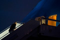 Biden stumbles up Air Force One stairs as he departs Poland
