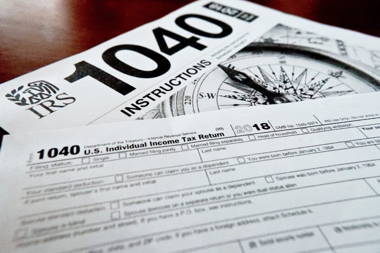 FILE- Internal Revenue Service taxes forms are seen on Feb. 13, 2019. (AP Photo/Keith Srakocic, File)
