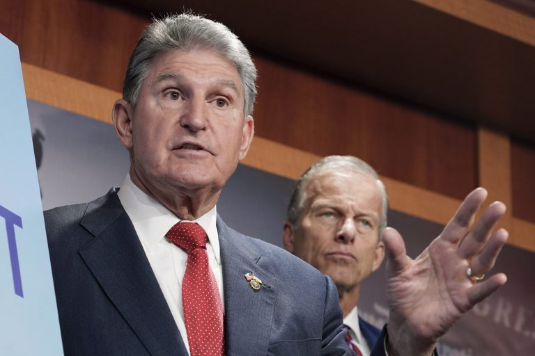 Sen. Joe Manchin, left, and Sen. John Thune, right, speak during the news conference to introduce the Restricting the Emergence of Security Threats that Risk Information Communications Technology Act, or RESTRICT Act, Tuesday, March 7, 2023, on Capitol Hill in Washington. 