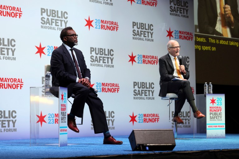 Chicago mayoral candidates Brandon Johnson, left, and Paul Vallas participate in a public safety forum in Chicago, Tuesday, March 14, 2023. 