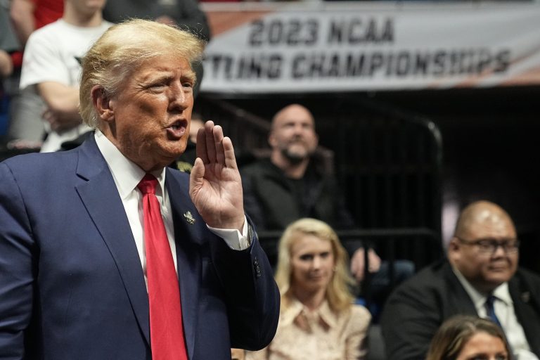 Former President Donald J. Trump watches the NCAA Wrestling Championships, Saturday, March 18, 2023, in Tulsa, Okla. 