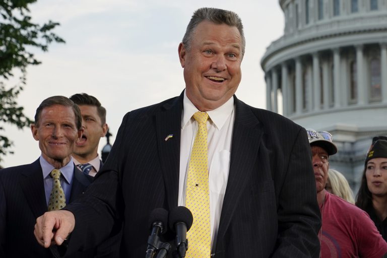 Sen. Jon Tester, D-Mont., speaks at a news conference alongside Sen. Richard Blumenthal, D-Conn., back left, on Aug. 2, 2022, on Capitol Hill in Washington. 