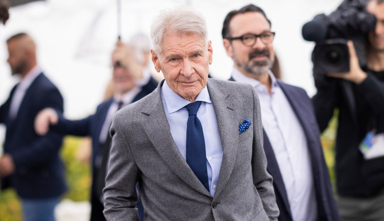 Harrison Ford poses for photographers at the photo call for the film 'Indiana Jones and the Dial of Destiny' at the 76th international film festival, Cannes, southern France, Friday, May 19, 2023.