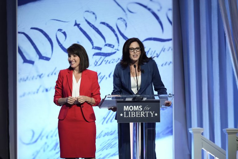 Moms for Liberty co-founders Tina Descovich, left, and Tiffany Justice speak at the Moms for Liberty meeting in Philadelphia on Friday, June 30, 2023.