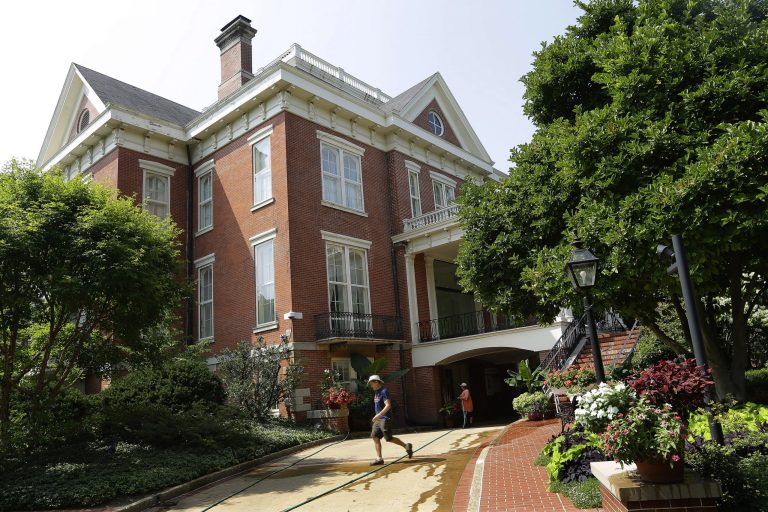 FILE - This Aug. 28, 2014 file photo shows workers outside the Illinois Executive Mansion in Springfield, Ill. 