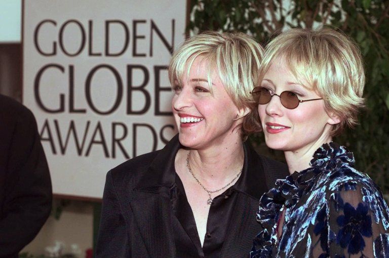 Actresses Ellen DeGeneres (left) and Anne Heche (right) arrive at the 55th Annual Golden Globe Awards in Beverly Hills, California, on Jan. 18, 1998.