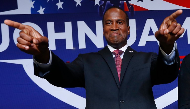 Republican U.S. Senate candidate John James arrives at a primary night election party in Detroit, Tuesday, Aug. 7, 2018.