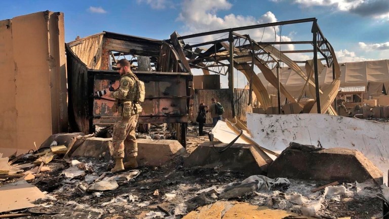 U.S. soldiers and journalists inspect the rubble at a site of Iranian bombing, in Ain al-Asad air base, Anbar, Iraq, Monday, Jan. 13, 2020. Ain al-Asad air base was struck by a barrage of Iranian missiles on Wednesday, in retaliation for the U.S. drone strike that killed atop Iranian commander, Gen. Qassem Soleimani, whose killing raised fears of a wider war in the Middle East.