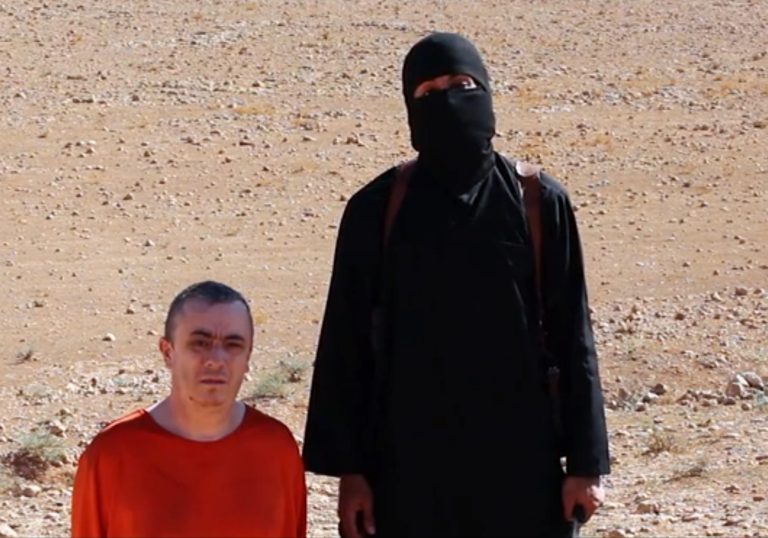 EDS NOTE: GRAPHIC CONTENT - This undated image shows a frame from a video released Friday, Oct. 3, 2014, by Islamic State militants that purports to show the killing of journalist Alan Henning by the militant group. Internet video released Friday purports to show an Islamic State group fighter beheading British hostage Alan Henning and threatening yet another American captive, the fourth such killing carried out by the extremist group now targeted in U.S.-led airstrikes.  (AP Photo) ONLINE OUT