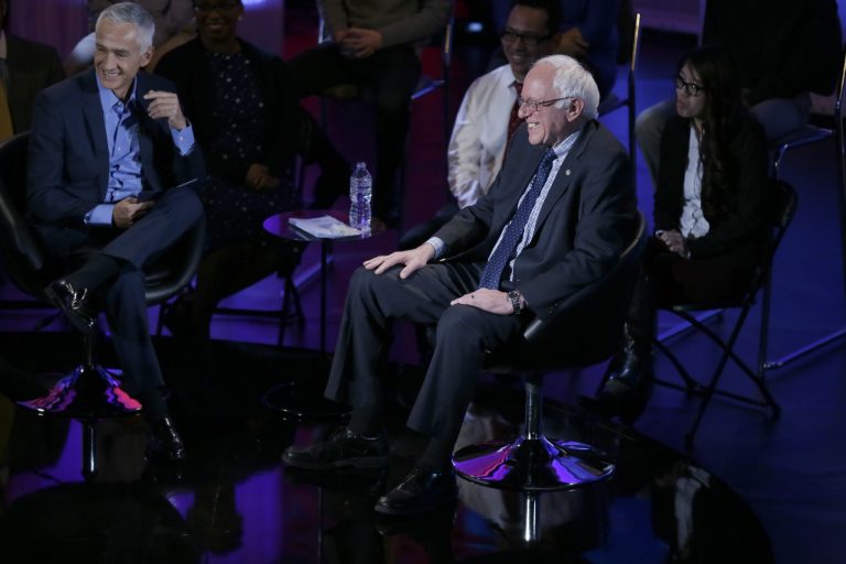 Democratic presidential candidate, Sen. Bernie Sanders, I-Vt, laughs as he talks to moderator Jorge Ramos during the Brown & Black Forum, Monday, Jan. 11, 2016, in Des Moines, Iowa. (AP Photo/Charlie Neibergall)