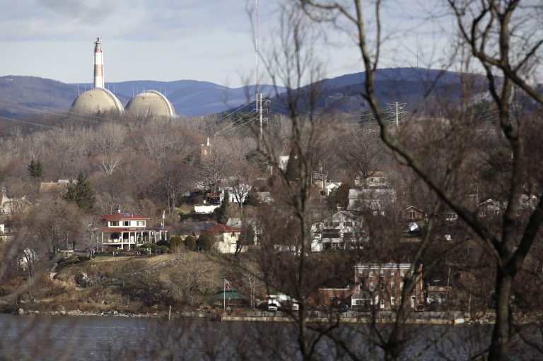 This Wednesday, Dec. 16, 2009 picture shows reactor containment domes of the Indian Point nuclear power plant in Buchanan, N.Y. above the homes just north of the town of Verplanck, N.Y. as seen from the Stony Point Historic Site, about 40 miles north of New York City. Nuclear sites were originally picked mainly in rural areas to lessen the impact of accidents. However, in a 2011 series, the AP reported population growth of up to 350 percent within 10 miles of nuclear sites between 1980 and 2010. About 120 million Americans - almost 40 percent - live within 50 miles of a nuclear power plant, according to the AP's analysis of Census data. (AP Photo/Julie Jacobson)