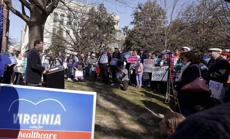 Marine veteran Mercedies Harris speaks during a rally in support of Medicaid expansion at Capitol Square in Richmond, Va., on Saturday, March, 15, 2014.  People attending Saturday's rally carried signs reading 